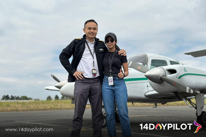 Student pilot posing in front of aircraft after completing FAA license conversion